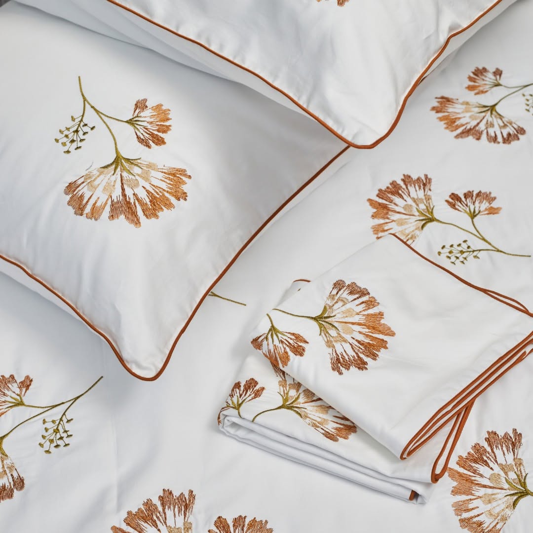 White Melchiah bedding embroidered with warm botanical motifs