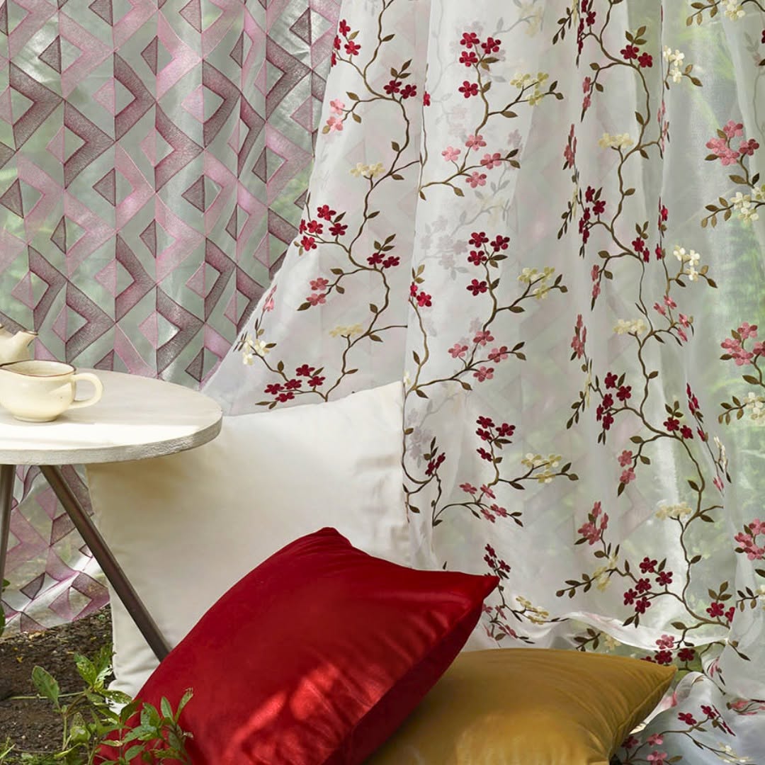 Melchiah embroidered floral curtains styled with coordinated velvet cushions