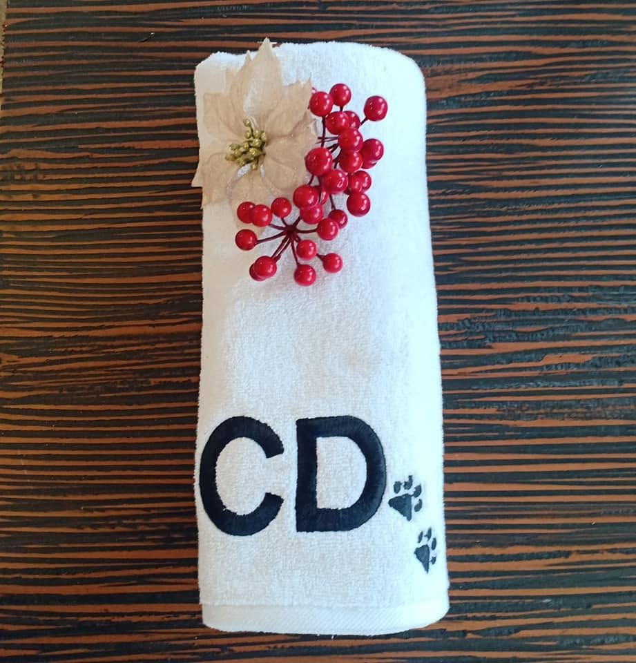 White Melchiah towel with a bold block-letter monogram styled for the holidays