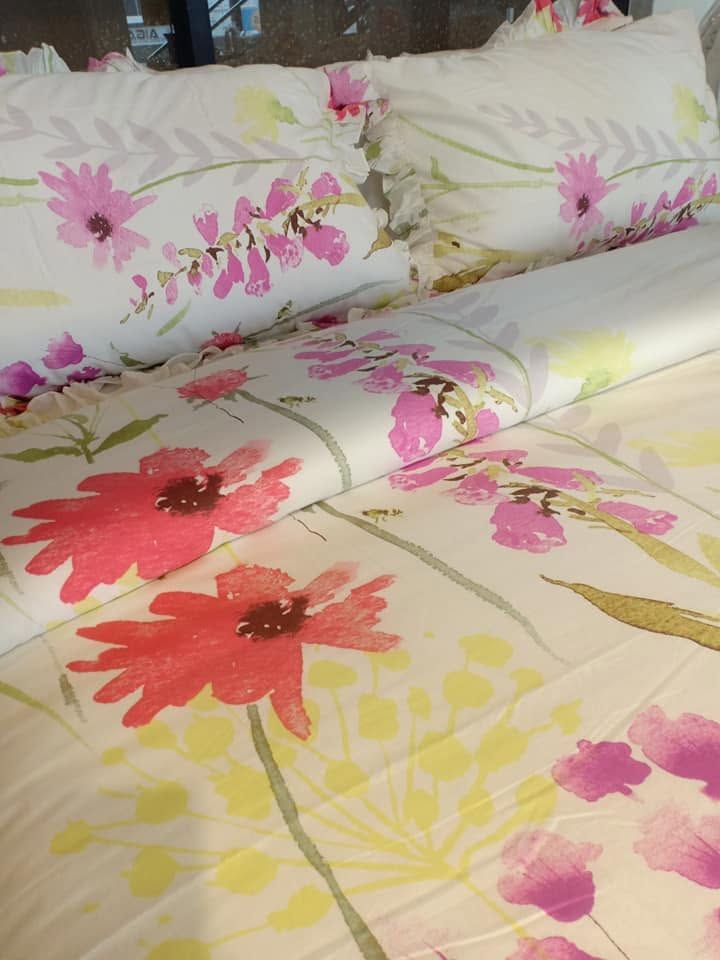 Cream Melchiah bedding printed with a painterly wildflower pattern