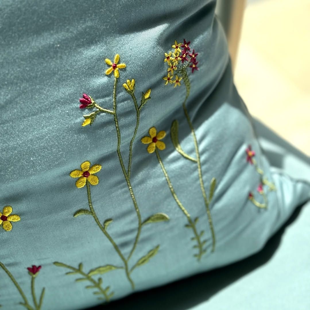 Rich teal Melchiah fabric hand-embroidered with gold florals
