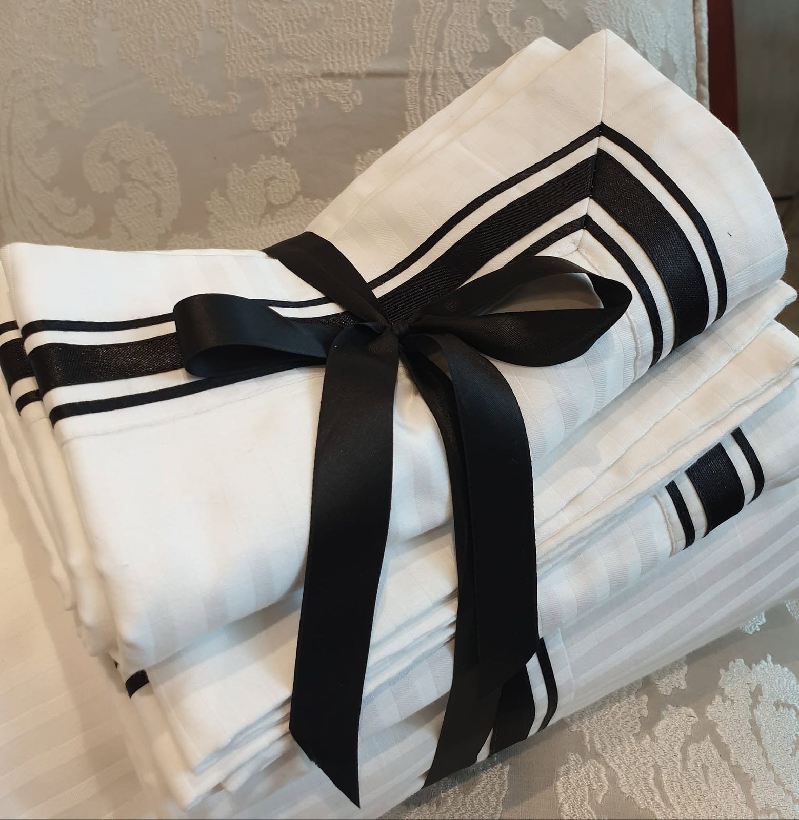 Tailored banded Melchiah linen bundle, ribbon-tied and ready to gift